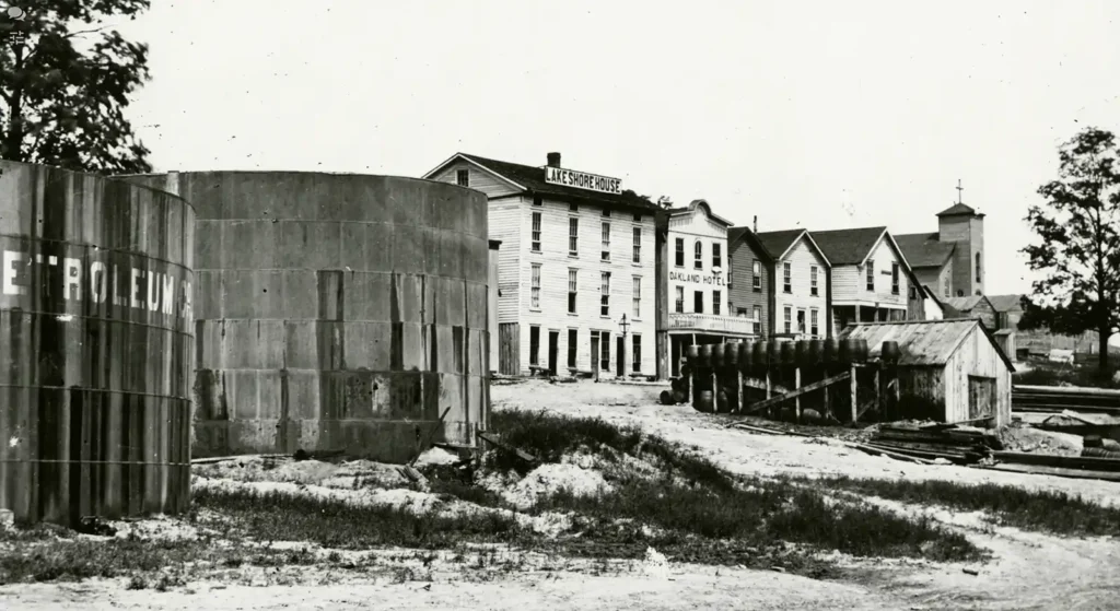 1866 photo of oil tanks and hotels in Petroleum Centre, PA, including Central Petroleum Company tanks and the Lake Shore House block.