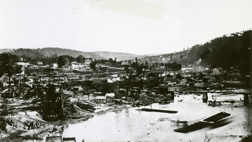 1864 photo of Petroleum Centre and Oil Creek, PA, before major growth by Central Petroleum Company on the McClintock farm.